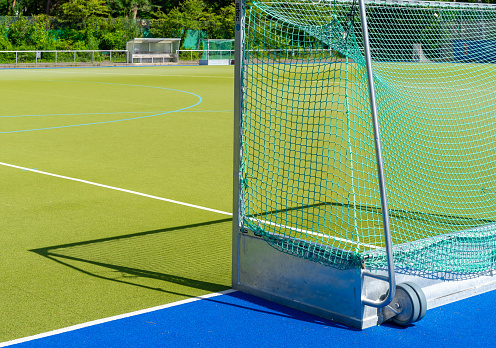 Close up of hockey goal against field