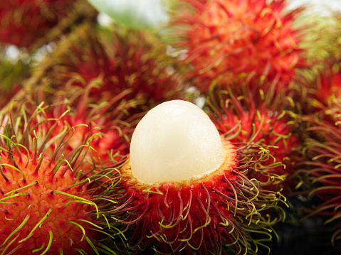 Rambutan tropical fruit in wooden table