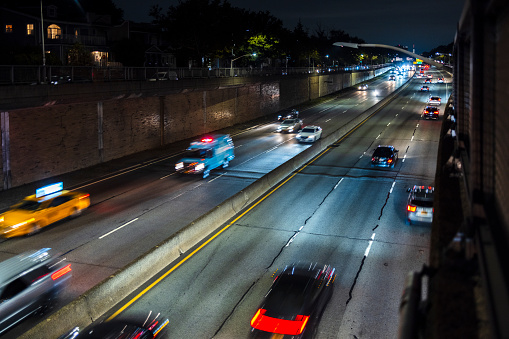 Night cars driving on Van Wyck Expressway, Queens, New York