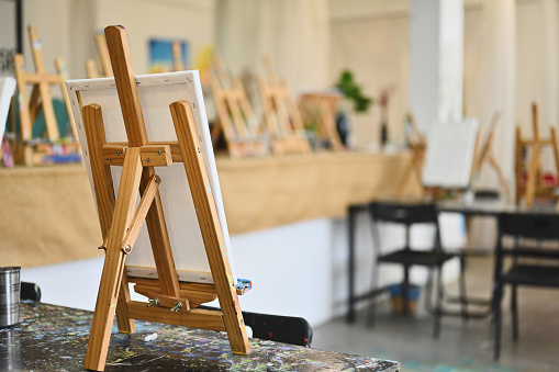 A Canvas setting on an easel in the studio workshop.