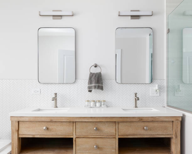 istock A bathroom detail with a white oak cabinet and herringbone backsplash. 1594269350