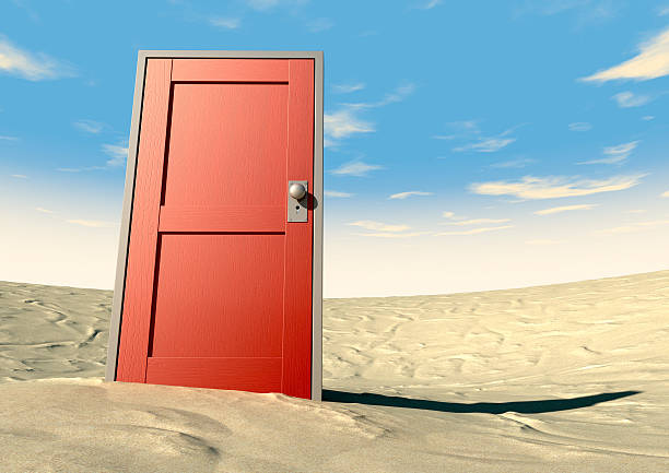 istock Red Door Closed In A Desert 159427802