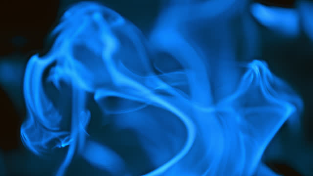 SUPER SLO MO Bluish flames of fire on black background