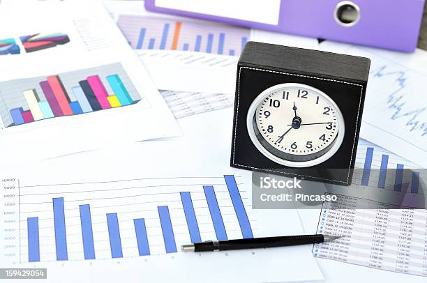 Clock Files And Pen On A Market Report Stock Photo - Download Image Now - Balance, Book, Business