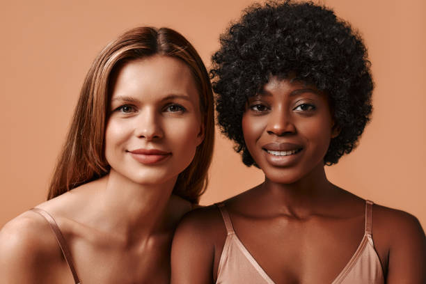 istock Multiethnic women on beige background 1594312938