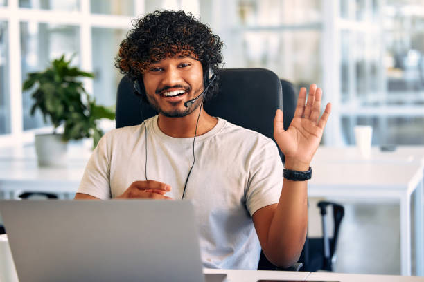 istock A call center worker sitting at a laptop in the office. 1594327383