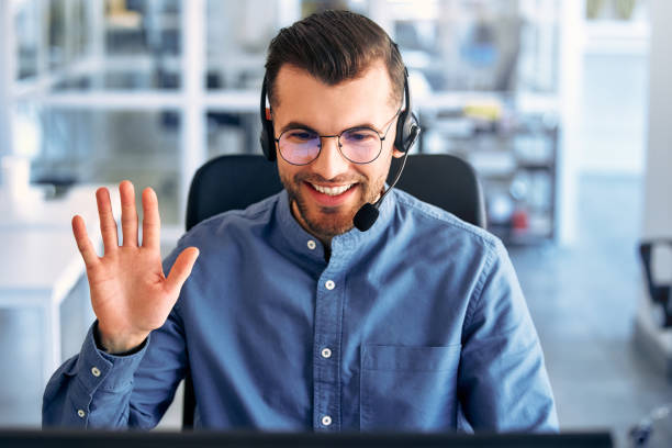 istock A call center worker sitting at a laptop in the office. 1594328466
