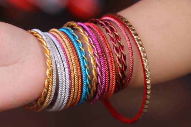 istock bangle  on a baby girl hand. 1594347820
