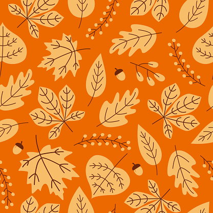 Autumn seamless pattern with season leaves, acorns and berries on orange background. Modern seasonal pattern. Vector trendy design
