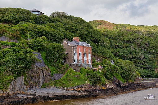 house on a stony cliff in Barmouth, UK