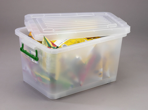 Half opened plastic container containing packages