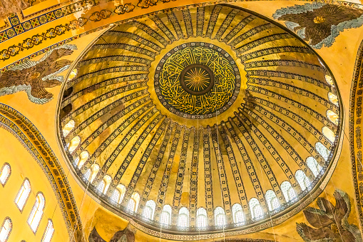 Hagia Sophia Mosque Basilica Dome Istanbul Turkey. Emperor Justinian build cathedral of Constantinople in 537 AD, which later became a mosque in 1453 and 2020. Dome surrounded by four Christian ancient angel mosaics.
