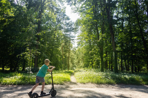 istock Kid fall when riding an electric scooter. Riding an e-scooter without protective gear. Increased risk of injury when using battery powered vehicles. Concept of problems in ensuring safety when driving 1594443867