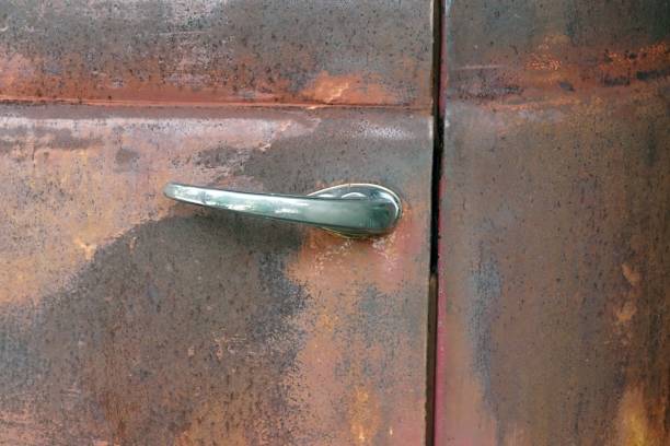 istock A old door handle of the rusty classic car, classic stlye concept. 1594487683