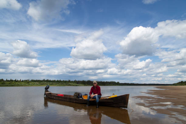 istock Handmade wooden boat with outboard motor 1594503073
