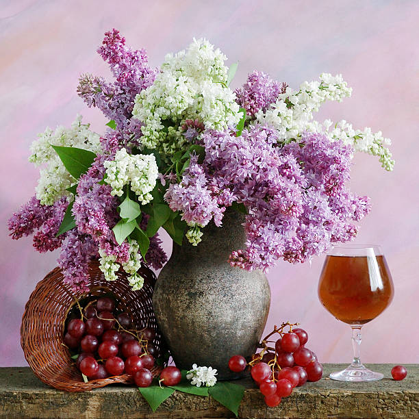 Still life with flowers bunch and fruits stock photo