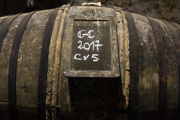 istock Old wine barrels at the winery in the cellar 1594554593