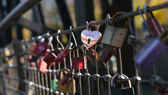 locks on the bridge that lovers hang