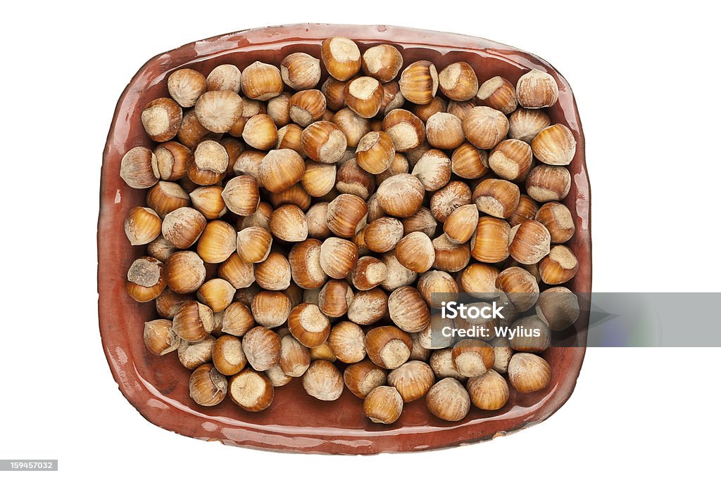 Plate of hazelnuts Plate of hazelnuts isolated on white background Autumn Stock Photo