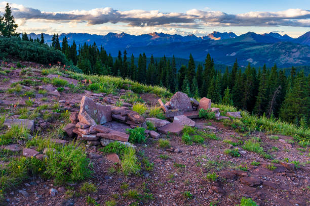 Rock Chair Seats Overlooking Gore Range Mountains - Scenic view with nobody and two seats made of of natural rock on high mountain ridge overlooking iconic and rugged Gore Range Mountains near Vail, Colorado USA.