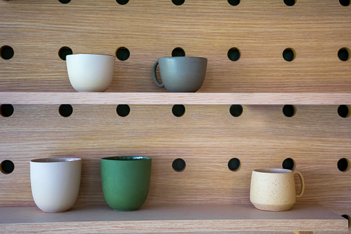 handmade ceramic cups on the shelf
