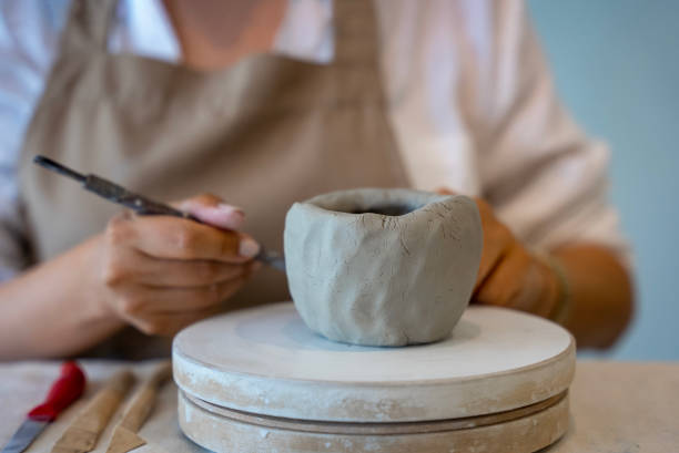 istock process of shaping ceramic clay into a mug at handmade ceramic workshop, shaping ceramics in the ceramics workshop 1594646451