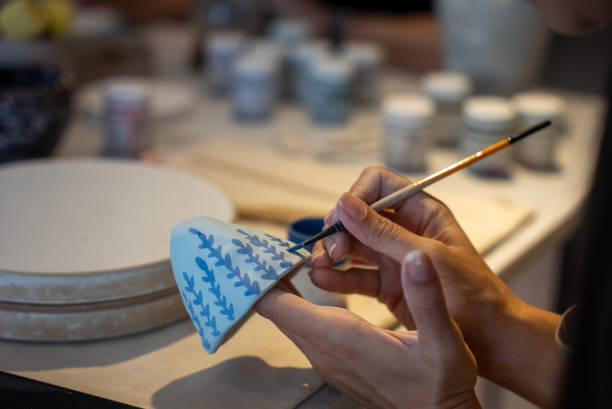 istock process of coloring ceramics in the workshop 1594650069