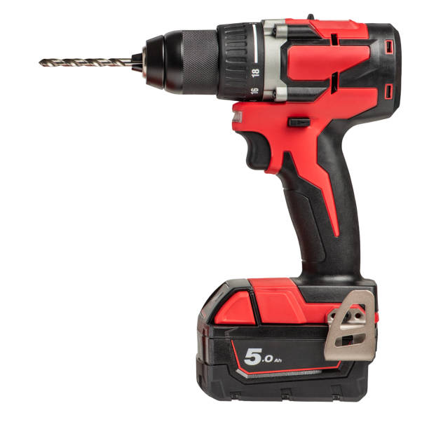 istock Cordless drill isolated on white background. New red cordless screwdriver with drill bit inserted, side view. Cordless power tool for drilling on a white background. 1594657505