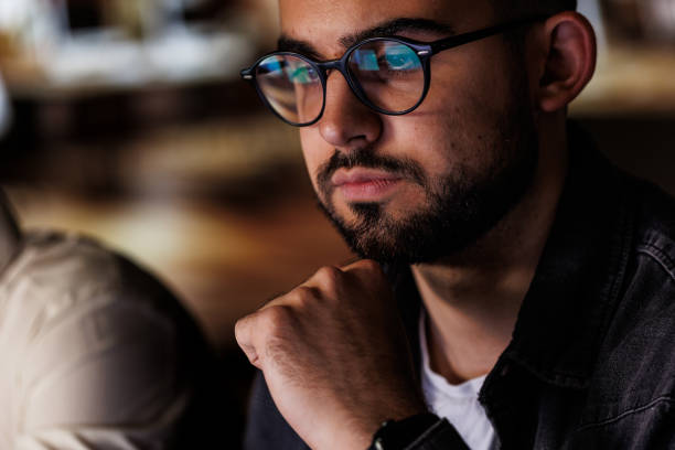 istock Focused young man using laptop when working late at the office 1594658033