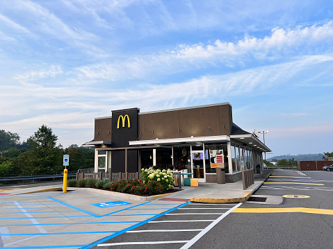 Gibsonia, USA.    August 5, 2023\nMcDonalds fast food restaurant in Gibsonia, PA.  Gibsonia is a community in Richland Township in Allegheny County north of Pittsburgh.   Partial cars can be seen.