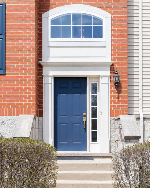 istock A blue front door on a red brick home. 1594721268