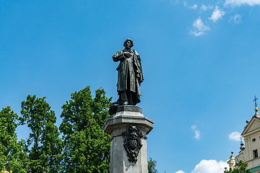 Close up shot of the Monument of Adam Mickiewicz in Warsaw, Poland