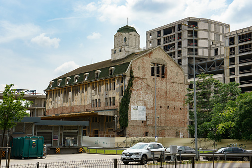 Bucharest, Romania - June 17, 2023: The Orzarie (barley) building under renovation of the former Erhard Luther Brewery founded in 1869. During the communist era it was confiscated and renamed as Grivita Beer Factory.