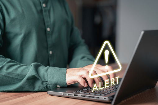 Underdown Sign On Computer User Working On Computer Laptop With Octagonal Shape Warning Sign For ...