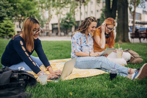 istock Female friends in park 1595032465