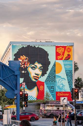 A mural in Santa Monica by Shepard Fairey at the Pierside Hotel in Santa Monica, California, USA, during sunset