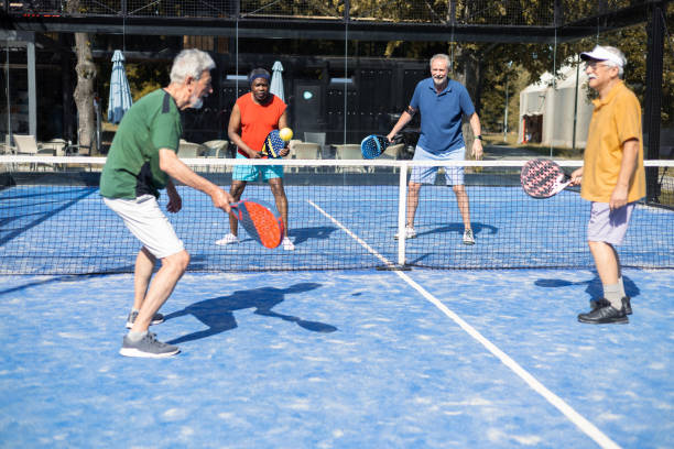 istock Four seniors on their weekend Paddle Tennis play 1595072145