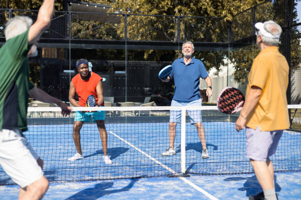 istock Four seniors playing Paddle Tennis in doubles 1595072449
