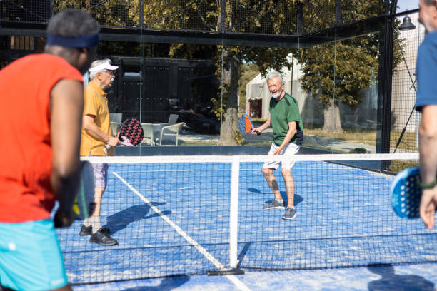 istock Senior friends on a weekend Paddle Tennis play 1595072681