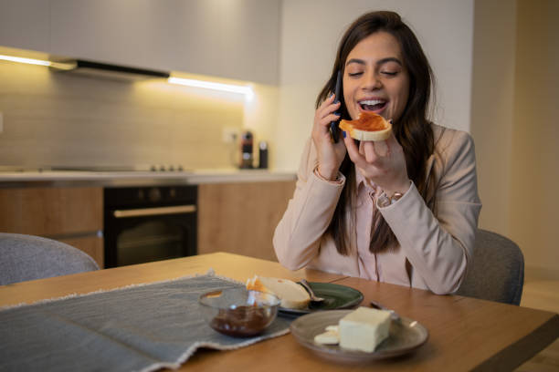 istock Happy young woman using phone 1595077895