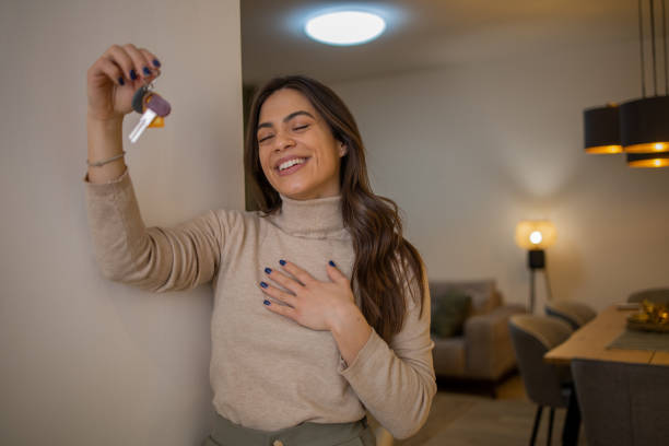 istock Woman moving into a new apartment 1595078440