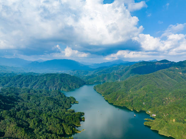 istock Large reservoir under blue sky and white clouds 1595128931