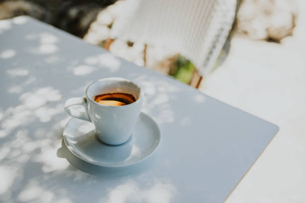 istock Cup of black coffee on a table in a street cafe. 1595206779