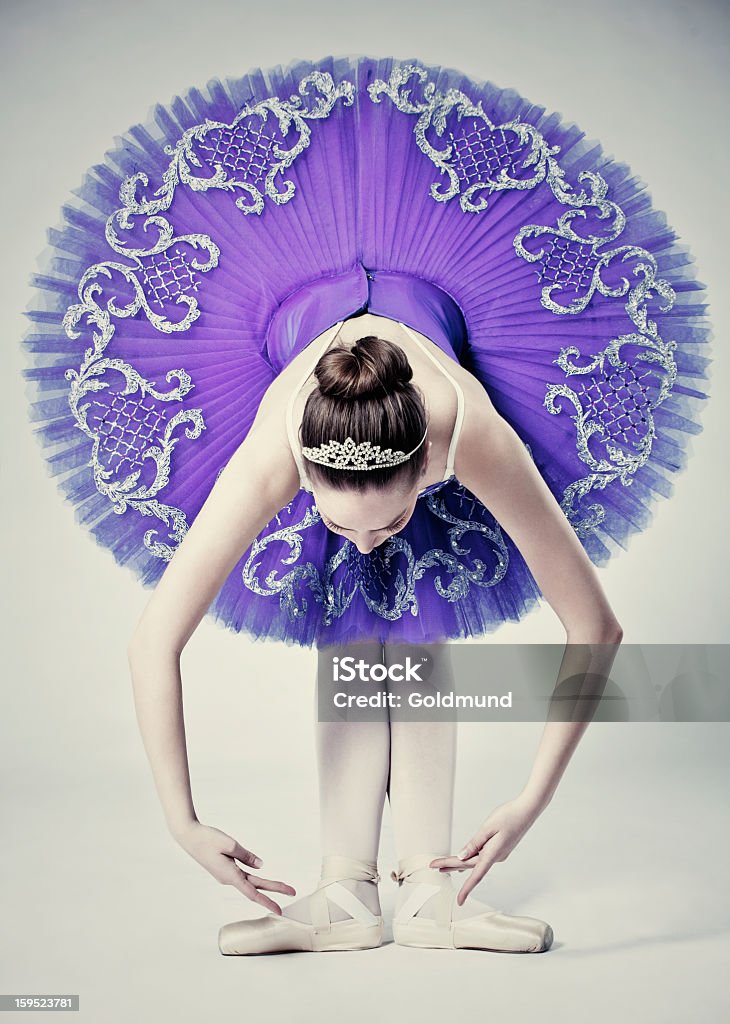 Ballet Dancer In Tutu Professional ballerina in tutu posing in studio on gray background. 20-29 Years Stock Photo