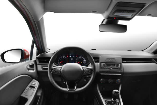 Driver's Perspective in a Modern Passenger Car Photo from the perspective of a driver in a modern passenger car, capturing the view of the steering wheel, front windshield, dashboard, gear shift, side mirrors, and rearview mirror, as if the viewer is sitting in the driver's seat steering wheel stock pictures, royalty-free photos & images