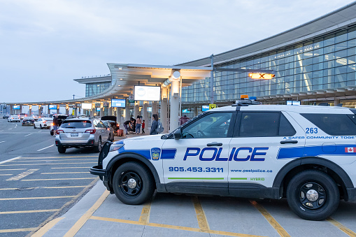 Mississauga, On, Canada-July 5, 2022: A Police car at pickup area of Toronto Pearson Airport. Pearson is the largest and busiest airport in Canada
