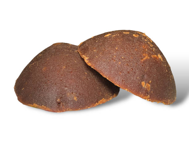 istock Organic brown palm sugar or coconut sugar, better known as Java sugar. Isolated on white background 1595299459