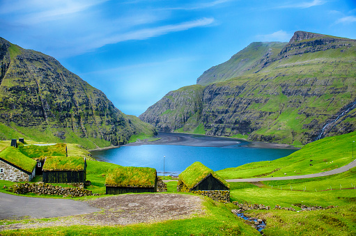 Village at saksun with grass on the roof with lagoon in Faroe Island