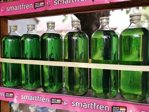 Bogor, Indonesia July 30 2023, bottles of premium fuel on a local traditional gas station display shelf for sale, usually sell to motorcycle rider.