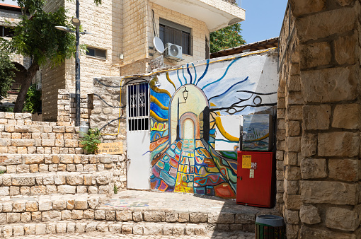 Safed, Israel, July 01, 2023 : Decoratively artistically painted wall of a private courtyard in the old part of Safed city in northern Israel
